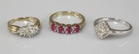 Lot 1012 - A 9ct gold ruby and diamond half hoop ring