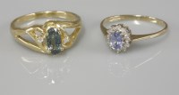 Lot 1025 - A 9ct gold sapphire and diamond oval cluster ring
