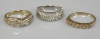 Lot 1042 - A 9ct white gold pavé set diamond band ring