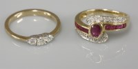 Lot 1036 - An 18ct gold ruby crossover ring