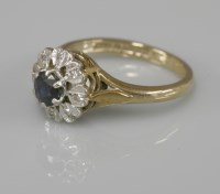 Lot 1041 - A 9ct gold sapphire and diamond cluster ring
