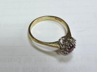 Lot 1022 - A 9ct gold ruby and diamond cluster ring