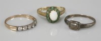 Lot 1029 - A 9ct gold opal and emerald oval cluster ring