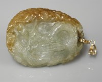 Lot 1061 - A carved jade pendant