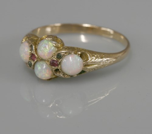 Lot 1030 - A late Victorian four stone opal ring