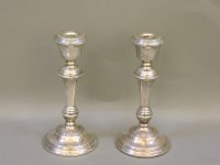 Lot 1283 - A pair of silver candlesticks