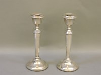 Lot 1287 - A pair of silver candlesticks
