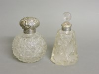 Lot 1211 - A cut glass and silver mounted scent bottle