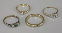 Lot 1010 - An emerald and diamond three stone ring