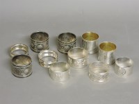 Lot 1144 - Eleven silver and plated napkin rings