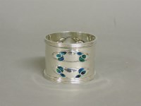 Lot 1133 - An Art Nouveau silver and enamel napkin ring
