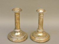 Lot 1262 - A pair of George III silver candlesticks