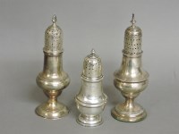 Lot 1148 - Two Georgian silver peppers
