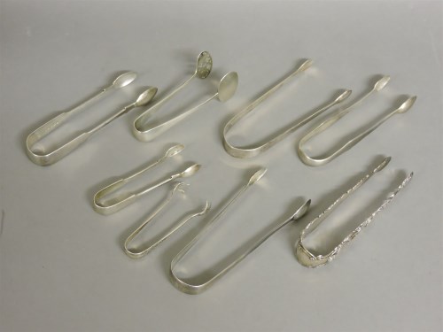 Lot 1121 - A collection of George III and later silver sugar tongs