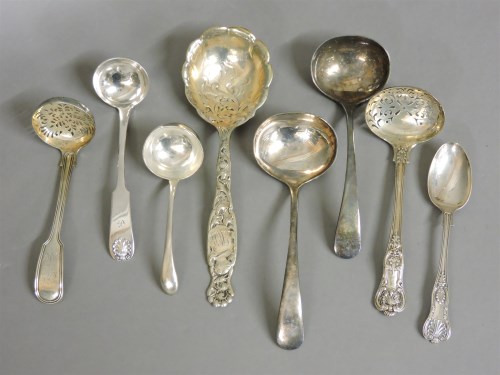 Lot 1163 - Four Victorian and later silver ladles and sifters