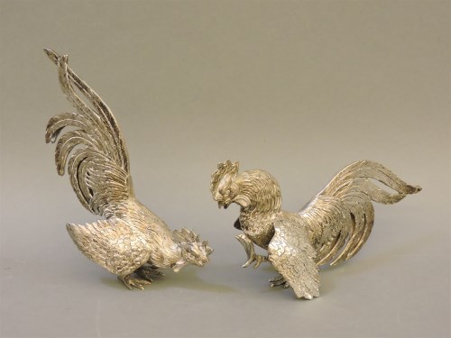 Lot 1252 - Two silver fighting cocks