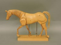 Lot 1605 - A beech artist's figure of an articulated horse