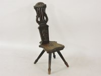 Lot 1215 - A late 19th/early 20th century carved oak spinning chair