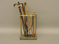 Lot 1559 - A brass and iron stick stand