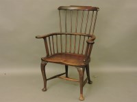 Lot 603 - A mahogany and walnut Windsor chair