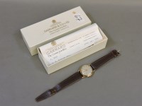 Lot 310 - A gentleman's 9ct gold Garrard mechanical strap watch