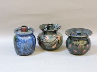 Lot 1561 - Three Elton 'Sunflower' pottery barrels and covers