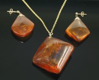 Lot 375 - An amber matched pendant and earring suite