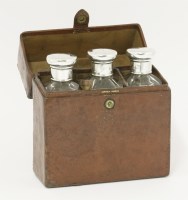 Lot 147 - A set of three silver mounted glass flasks