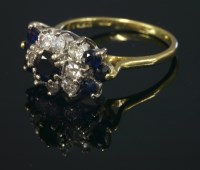 Lot 681 - An 18ct gold sapphire and diamond cluster ring