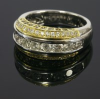 Lot 612 - An 18ct yellow and white gold diamond set band ring