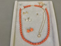 Lot 271 - A single row olive shaped coral bead necklace