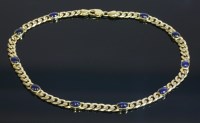 Lot 548 - A Continental gold and sapphire set curb chain necklace