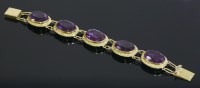 Lot 495 - A gold synthetic colour change sapphire bracelet