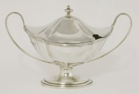 Lot 75 - An Edwardian silver two-handled sauce tureen and cover