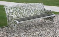 Lot 371 - A Coalbrookdale 'Nasturtium' pattern cast iron garden seat