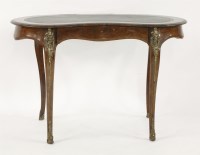 Lot 385 - A French walnut kidney-shaped writing table