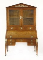 Lot 343 - A French Empire fruitwood cylinder bureau bookcase