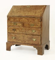 Lot 394 - A George II strung and crossbanded walnut bureau