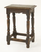 Lot 396 - An oak joined stool