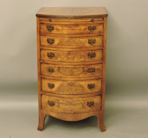 Lot 1809 - A 1930s walnut bow front chest of six drawers