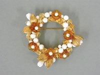Lot 2 - A gold-plated circle brooch