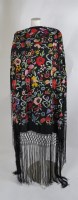 Lot 212 - A highly embroidered black piano shawl