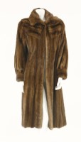 Lot 334 - A light brown mink mid-length fur coat
short collar with cuffed sleeves and brown silky lining