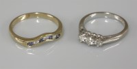Lot 1021 - An 18ct white gold three stone diamond ring