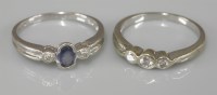 Lot 1037 - A 9ct white gold three stone diamond ring