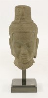 Lot 20 - A Thai carved sandstone head of a deity