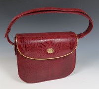 Lot 377 - A vintage Gucci red leather lizard skin handbag
