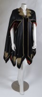 Lot 209 - A black satin and silk velvet cape