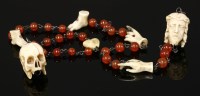 Lot 377 - An antique cornelian and carved ivory incomplete rosary