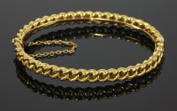 Lot 387 - A cased late Victorian gold hinged bangle